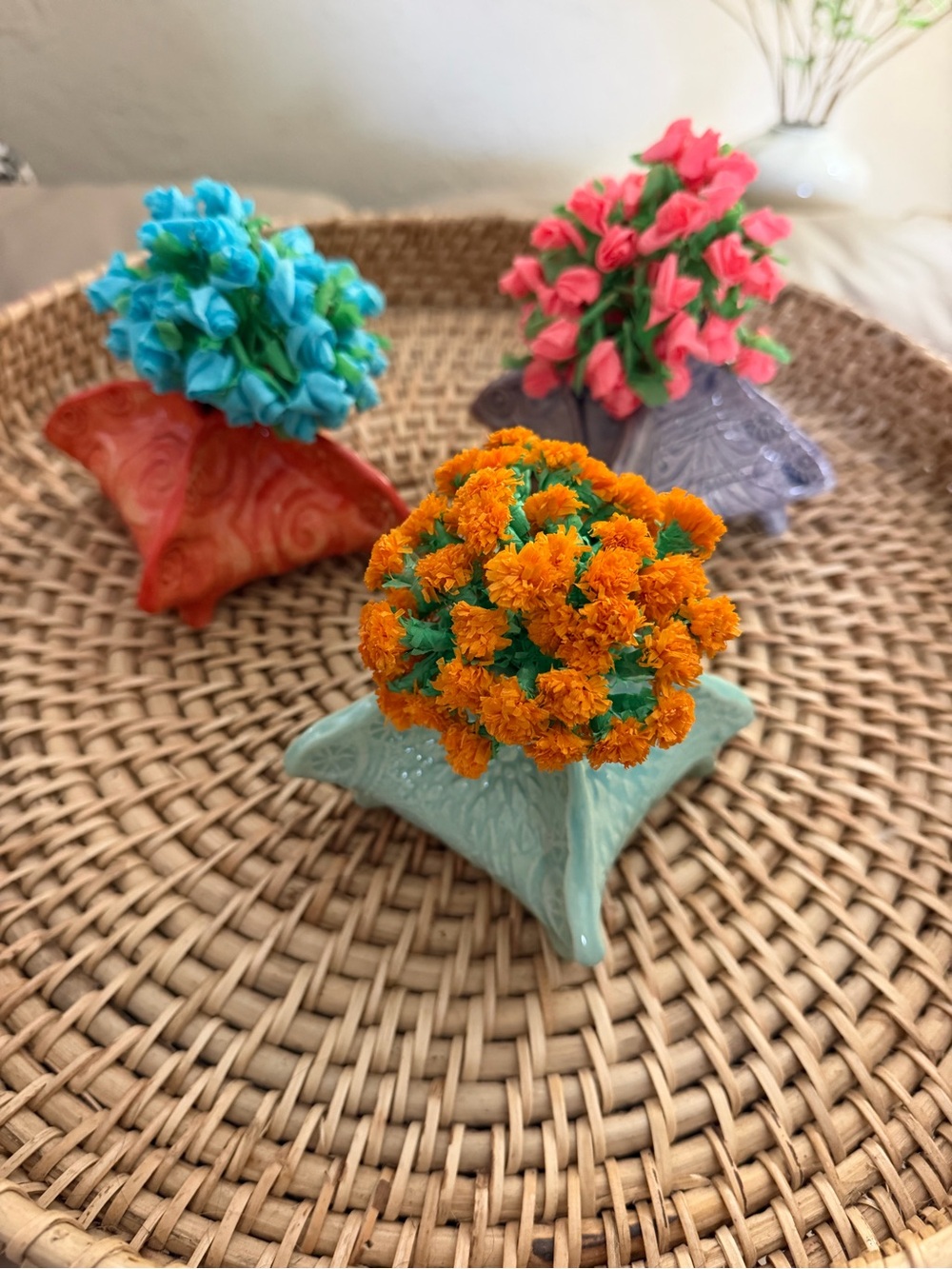 Three Lorraine Oerth pottery vases with paper flowers